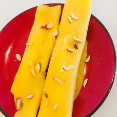 A picture of Mango Patishapta(mango crepes).