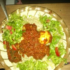 A picture of Spaghetti and macaroni with stew and salad,fish and egg.
