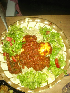 A picture of Spaghetti and macaroni with stew and salad,fish and egg.