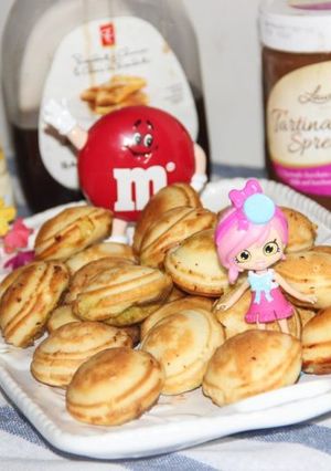 A picture of Ebelskivers With Chocolate / Chocolate Stuffed Mini Pancakes.