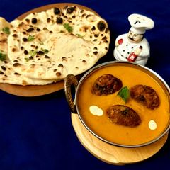 A picture of Suran Koftas made in Appe Pan with Smoky Flavoured Makhani Gravy.