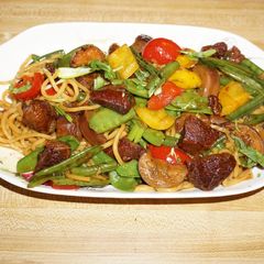 A picture of CHINESE BEEF STEW WITH STIR-FRY VEGETABLES AND LO MEIN NOODLES. JON STYLE.