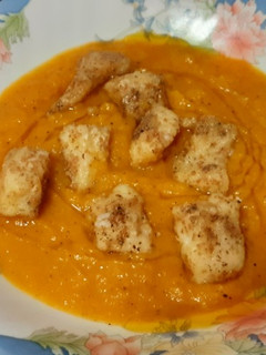 Una foto de Bacalao con puré de calabaza y puerro