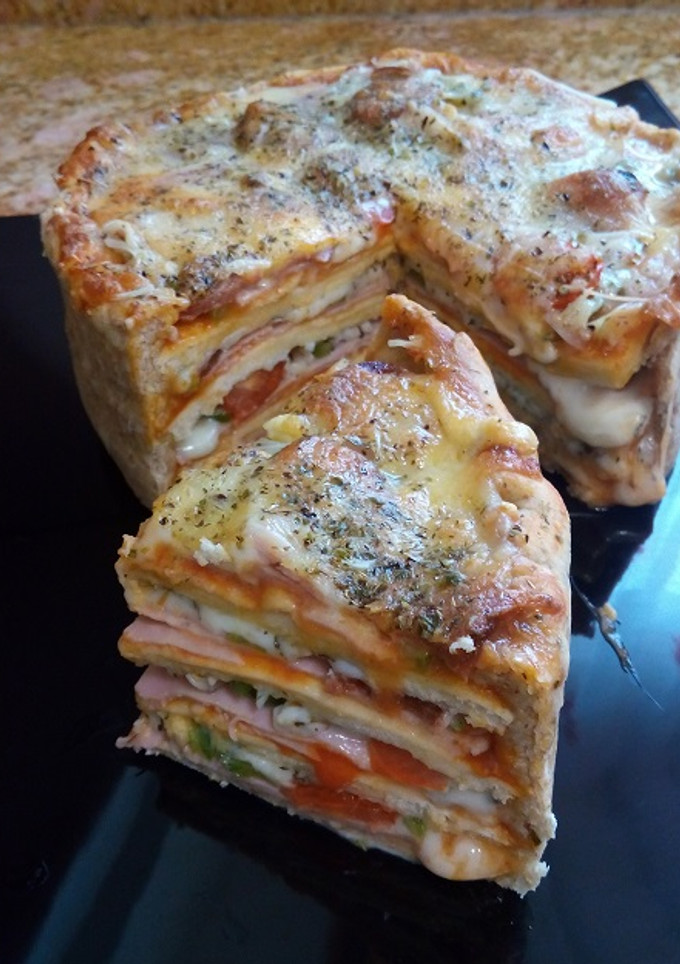 Una foto de Pizza reina, pastel pizza