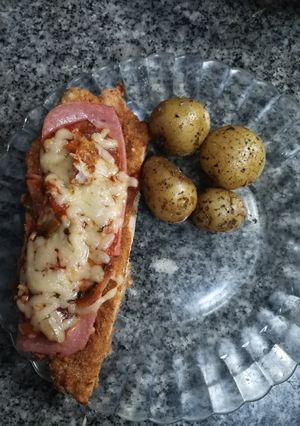 Una foto de Milanesas de cerdo a la parmesana