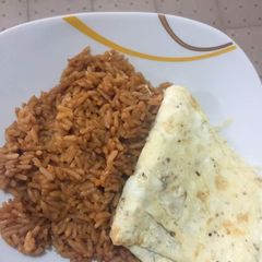 A picture of Jollof Rice & Fried Egg.