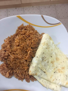 A picture of Jollof Rice & Fried Egg.