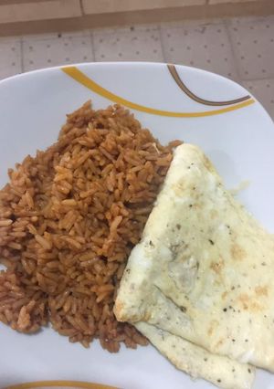 A picture of Jollof Rice & Fried Egg.