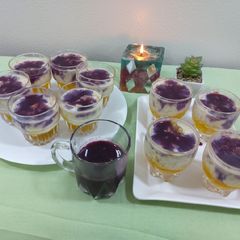 A picture of Fruits creamy with pineapple jelly and black currant sauce.