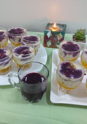 A picture of Fruits creamy with pineapple jelly and black currant sauce.