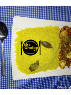 A picture of Cous cous with egg and fish sauce.
