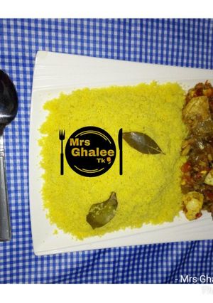 A picture of Cous cous with egg and fish sauce.