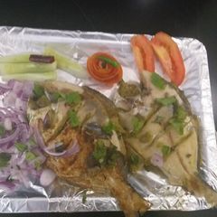 A picture of Green masala stuffed fish pomfret.