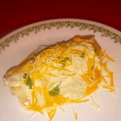 A picture of Chimichangas w/ spicy avocado cream and queso.