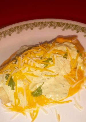 A picture of Chimichangas w/ spicy avocado cream and queso.