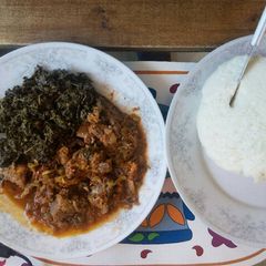 Dry fry meat and ugali with managu/mchicha A picture of Dry fry meat and ugali with managu/mchicha.