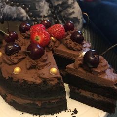 A picture of Chocolate cake with chocolate fresh cream.