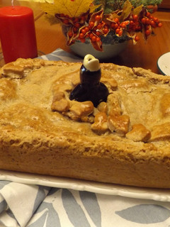 Una foto de Pie de manzana con almendras y nueces