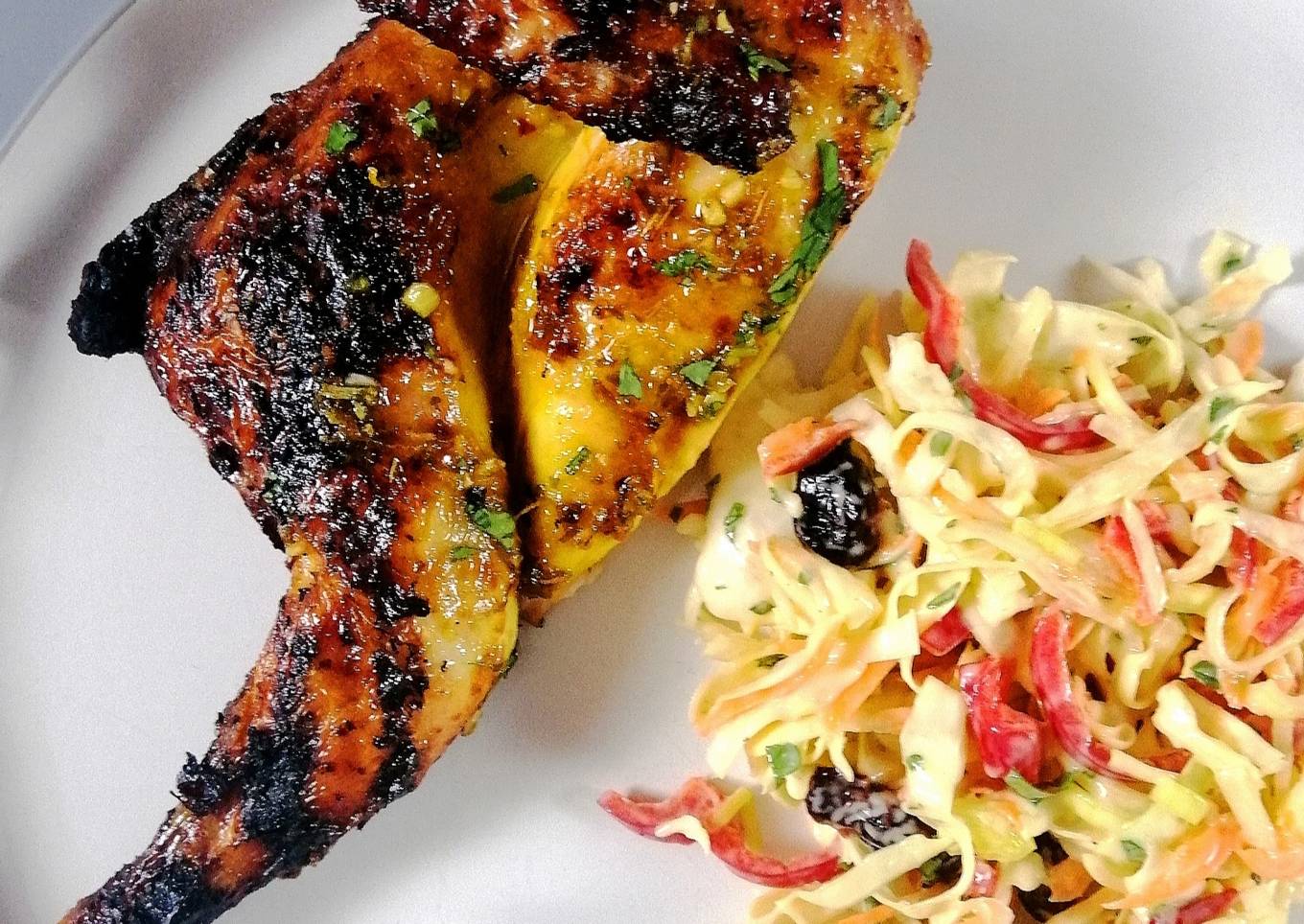 Spatchcock poussin glazed with orange and honey and festive slaw