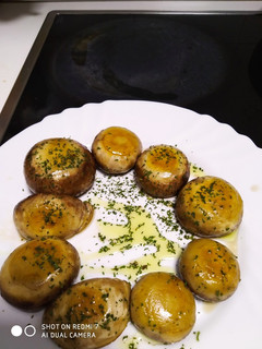 Una foto de Champiñones a la plancha