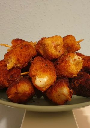 A picture of Skewers of Cooked Pork Loin and Manchego Cheese.