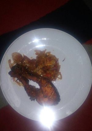A picture of Roasted Fish with pepper/onion sauce...