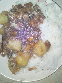 A picture of Rice served with beef stew.