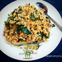 A picture of Local Jollof Rice with moringa.