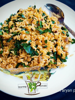 A picture of Local Jollof Rice with moringa.