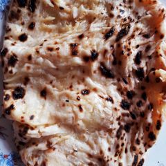 A picture of Aloo stuffed garlic naan.