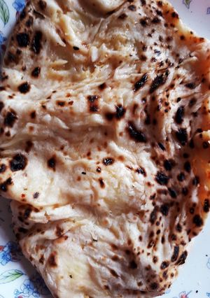 A picture of Aloo stuffed garlic naan.