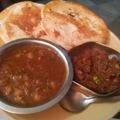A picture of White chana with kulcha.