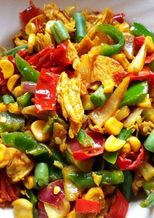 A picture of Shredded chicken and atir fried vegetables.