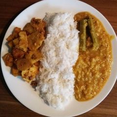 A picture of Plantain tomato tamarind curry.