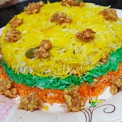 A picture of Chicken in rainbow rice.