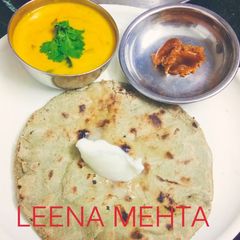 A picture of Brinjal Kadhi with bajra roti.