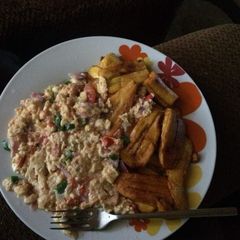 A picture of Fried plantain with fried eggs.