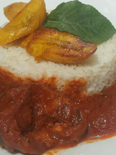 A picture of Catfish stew with white rice.