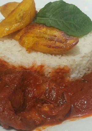 A picture of Catfish stew with white rice.