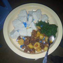 A picture of Ugali, sukuma and beef.