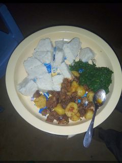 A picture of Ugali, sukuma and beef.