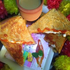 Schezwan - mayo sandwich with kulhar chai😋 A picture of Schezwan - mayo sandwich with kulhar chai😋.