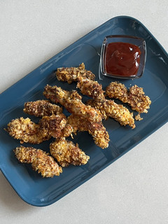 Una foto de Pollo rebozado en Corn Flakes