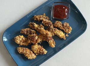 Una foto de Pollo rebozado en Corn Flakes