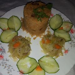 A picture of Pilau rice and steammed cabbage.