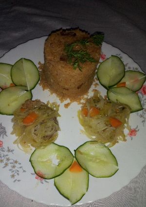 A picture of Pilau rice and steammed cabbage.