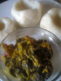 A picture of Bitterleaf Soup and pounded yam.