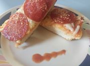 A picture of pizza and garlic bread