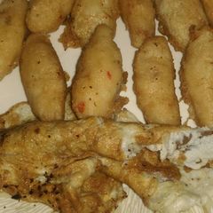 A picture of Potatoes in egg.