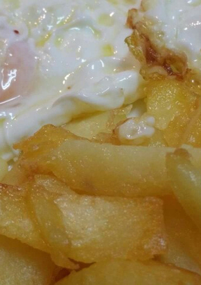 Una foto de Papas en aceite de Pescada